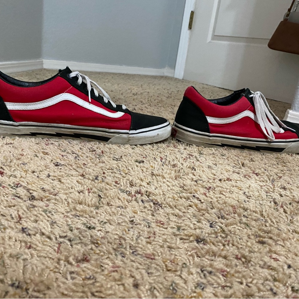 red and black custom designed vans. worn but in good condition